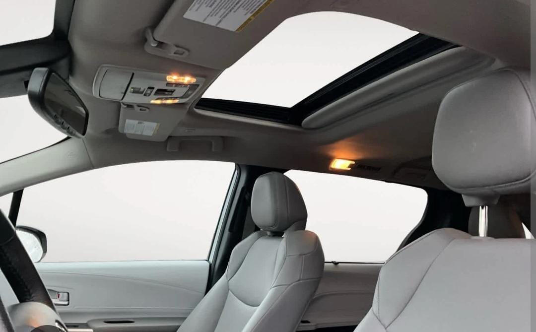 Front seats and panoramic roof Minivan front passenger seats beneath a panoramic roof.