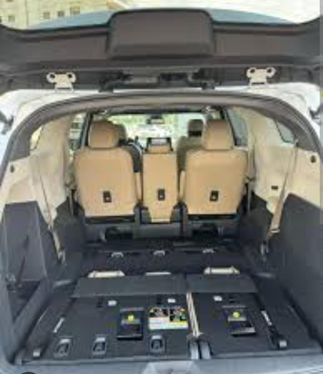 Toyota Sienna rear seating View into the Toyota Sienna from the rear with three passenger seats visible.
